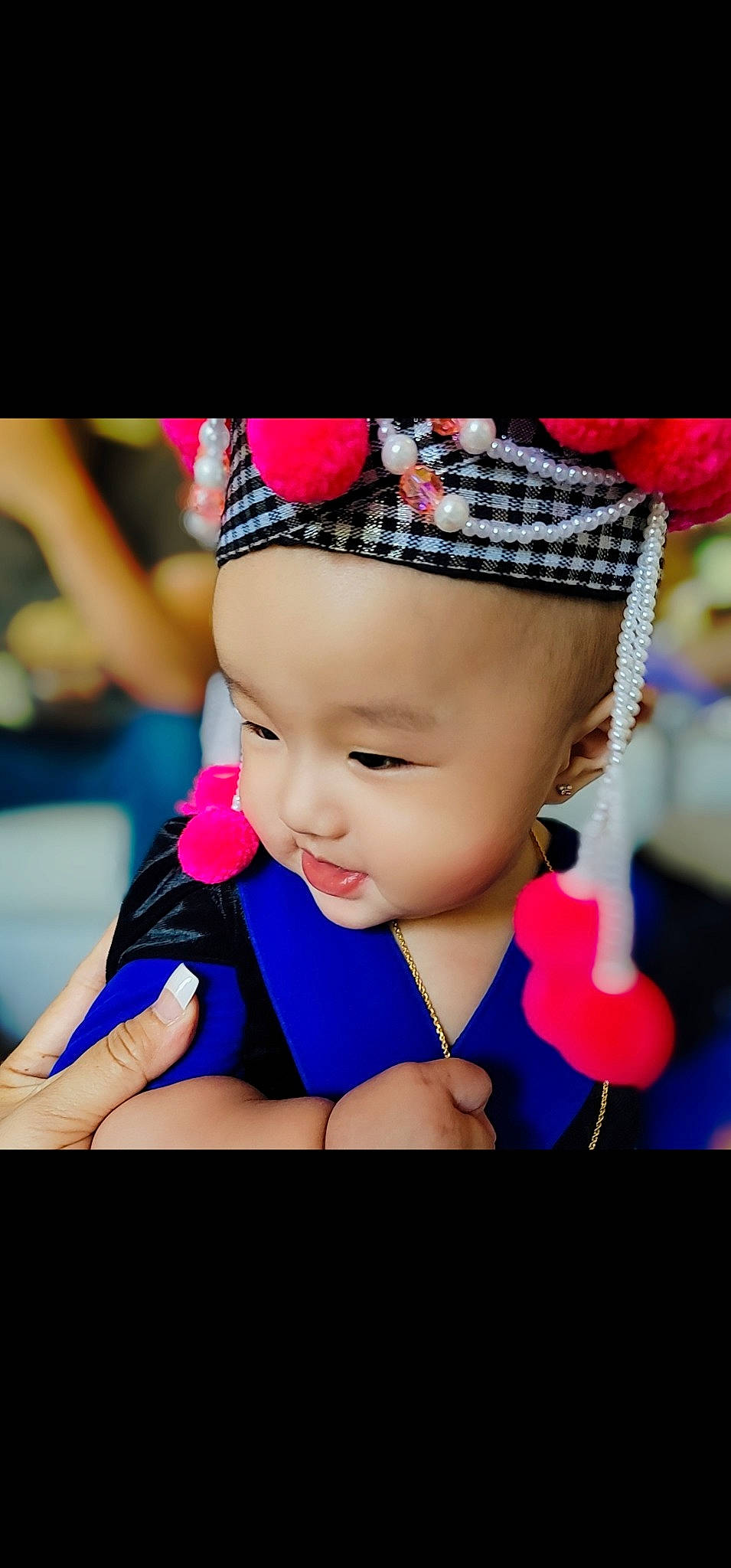 Ameela is registered to the contest to win money with this photo: baby, beanie, cap, child, costume_hat, electric_blue, entertainment, event, fashion_accessory, fun, hair_accessory, happy, hat, headband, headpiece, headwear, magenta, pattern, person, pink