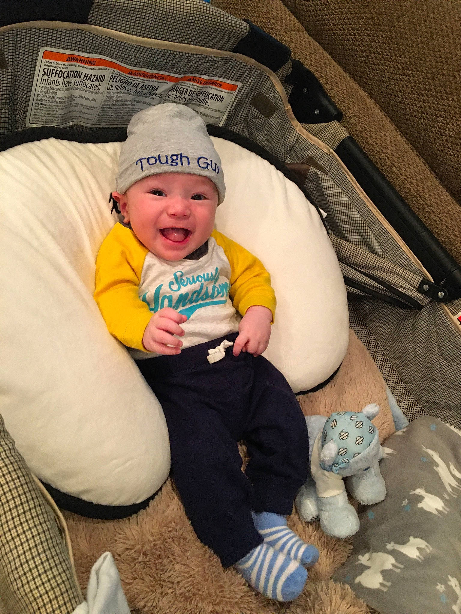 Gavin is registered to the contest to win money with this photo: baby, baby_in_car_seat, child, comfort, fun, headwear, person, sitting, smile, toddler, vacation