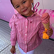 Syana participe au concours pour gagner de l'argent avec cette photo : child, girl, pink_shirt, white_pants, ice_cream, cone, headband, butterfly, smile, braid, floor, metal_floor, pastel_background, playful, holding, sweet_treat, summer, cute, happy, standing