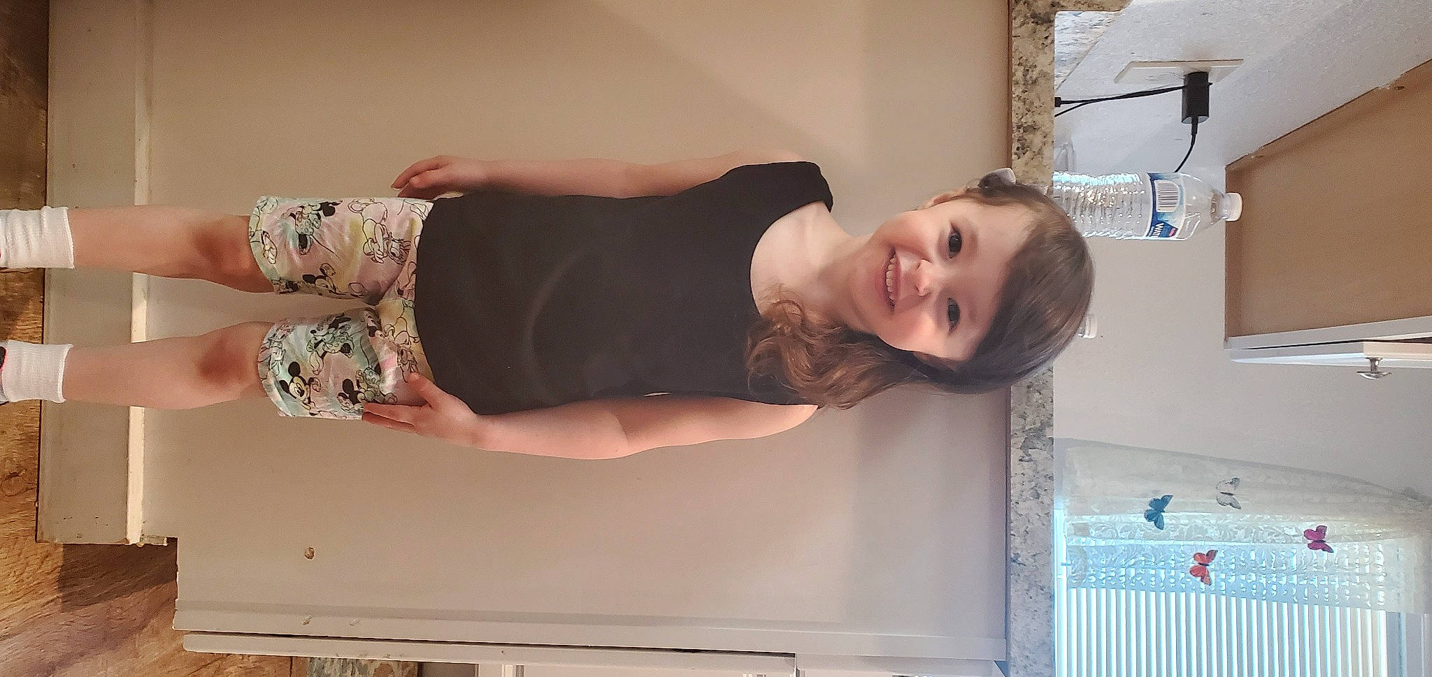 Constance is registered to the contest to win money with this photo: abdomen, blond, child, comfort, dress, elbow, fun, happy, human_body, human_leg, joint, joy, knee, long_hair, person, room, shoulder, smile, thigh, trunk