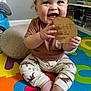 Calais joined the competition — help win amazing prizes! baby, bookshelf, child, clothing, colorful_mat, cute, dinosaur_print, eight_months, expression, footwear_free, happy, indoors, infant, milestone, person, plaque, playtime, sitting, smiling, toy