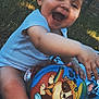 baby, ball, blanket, child, clothing, cute, fence, foot, grass, hand, happy, head, laughing, outdoor, person, play, sitting, smiling, sunlight, toy