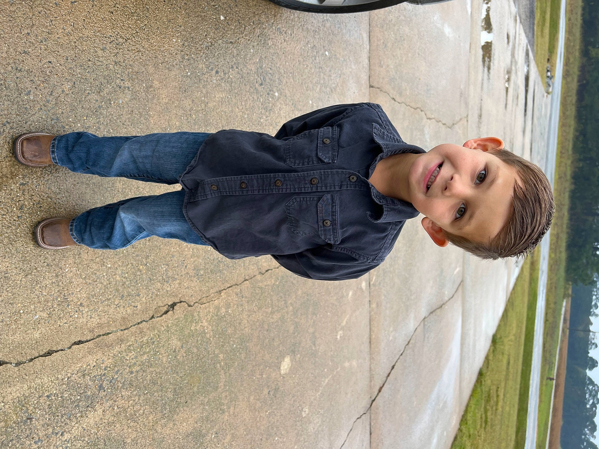 Jackson joined the competition — help win amazing prizes! asphalt, automotive_tire, concrete, denim, foot, happy, human_leg, joy, person, plant, road_surface, shadow, smile, tree, walking_shoe, window