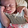 Emily joined the competition — help win amazing prizes! baby, infant, sleeping, newborn, blanket, swaddle, bow, hand, face, closeup, portrait, lip, eyelashes, arm, fabric, soft_texture, indoors, furniture, peaceful, nursery