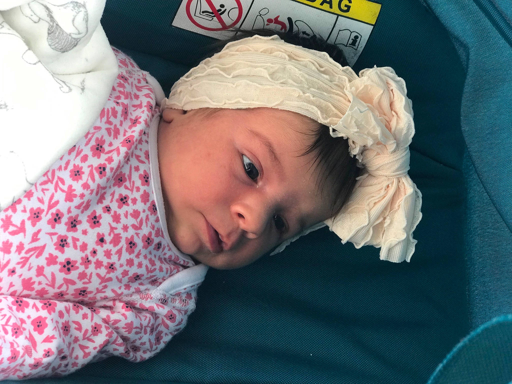 Medeea is registered to the contest to win money with this photo: baby, baby_toddler_clothing, cap, cheek, child, comfort, eye, eyebrow, eyelash, fashion_accessory, happy, headpiece, headwear, linens, lip, mouth, person, pink, room, skin