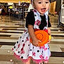 Savanna joined the competition — help win amazing prizes! bow, chair, child, cute, dress, floor, footwear, happy, headband, indoor, light_effects, pattern, person, playful, polka_dot, shoes, smile, table, toddler, toy