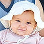 baby, baby_clothes, child, closeup, clothing, cute, expression, eyes, face, happy, hat, headwear, infant, person, pink_outfit, portrait, skin, smile, sun_hat, white_hat