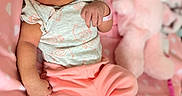 Honestee is registered to the contest to win money with this photo: arm, baby, baby_toddler_clothing, cheek, comfort, eye, face, facial_expression, finger, gesture, hand, happy, leg, mouth, muscle, pink, skin, sleeve, stomach, textile