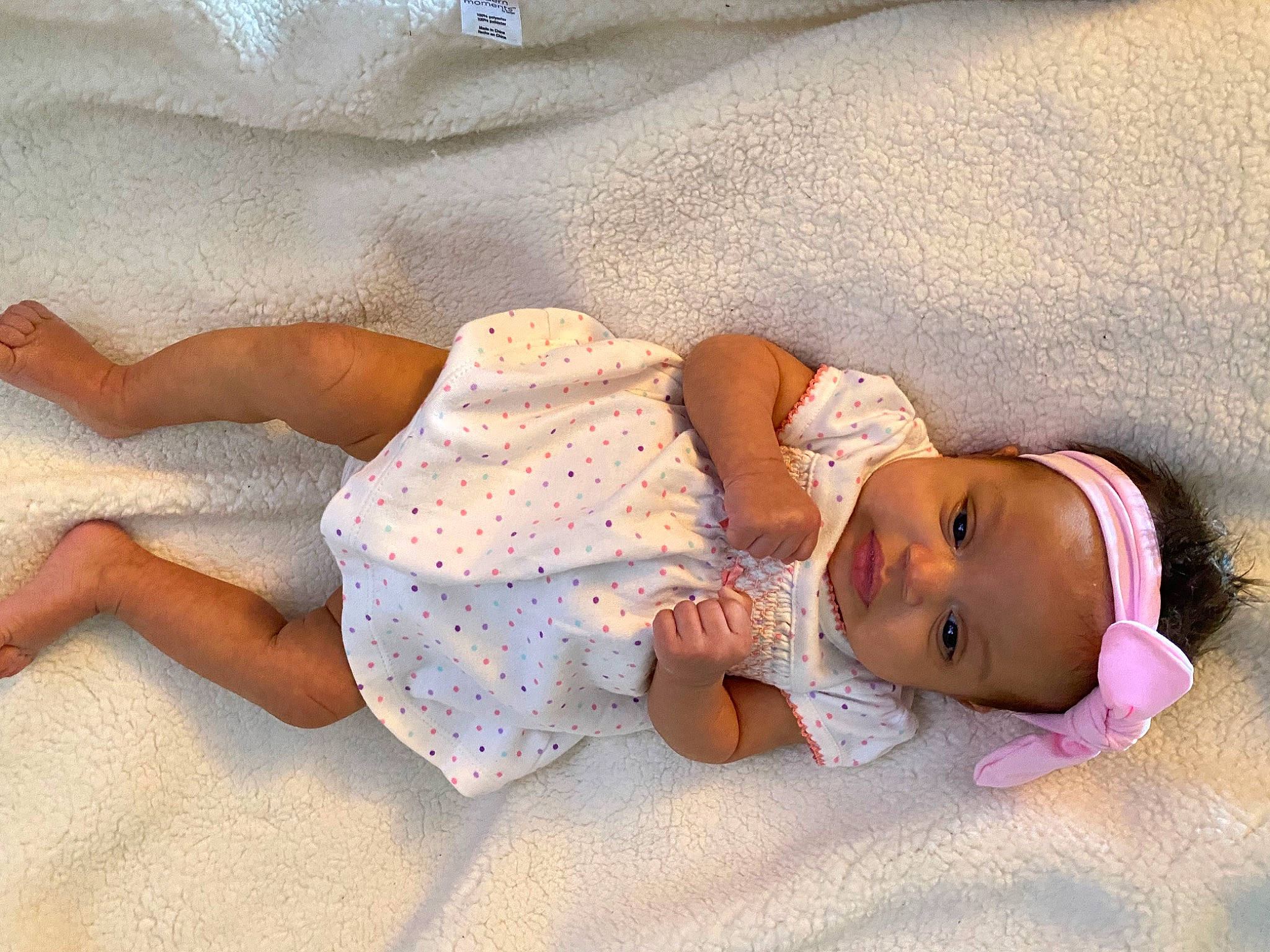 Kelani joined the competition — help win amazing prizes! baby, baby_sleeping, baby_toddler_clothing, barefoot, beach, child, comfort, hand, head, headgear, human, human_body, leg, linens, pattern, person, sand, skin, sleeve, textile