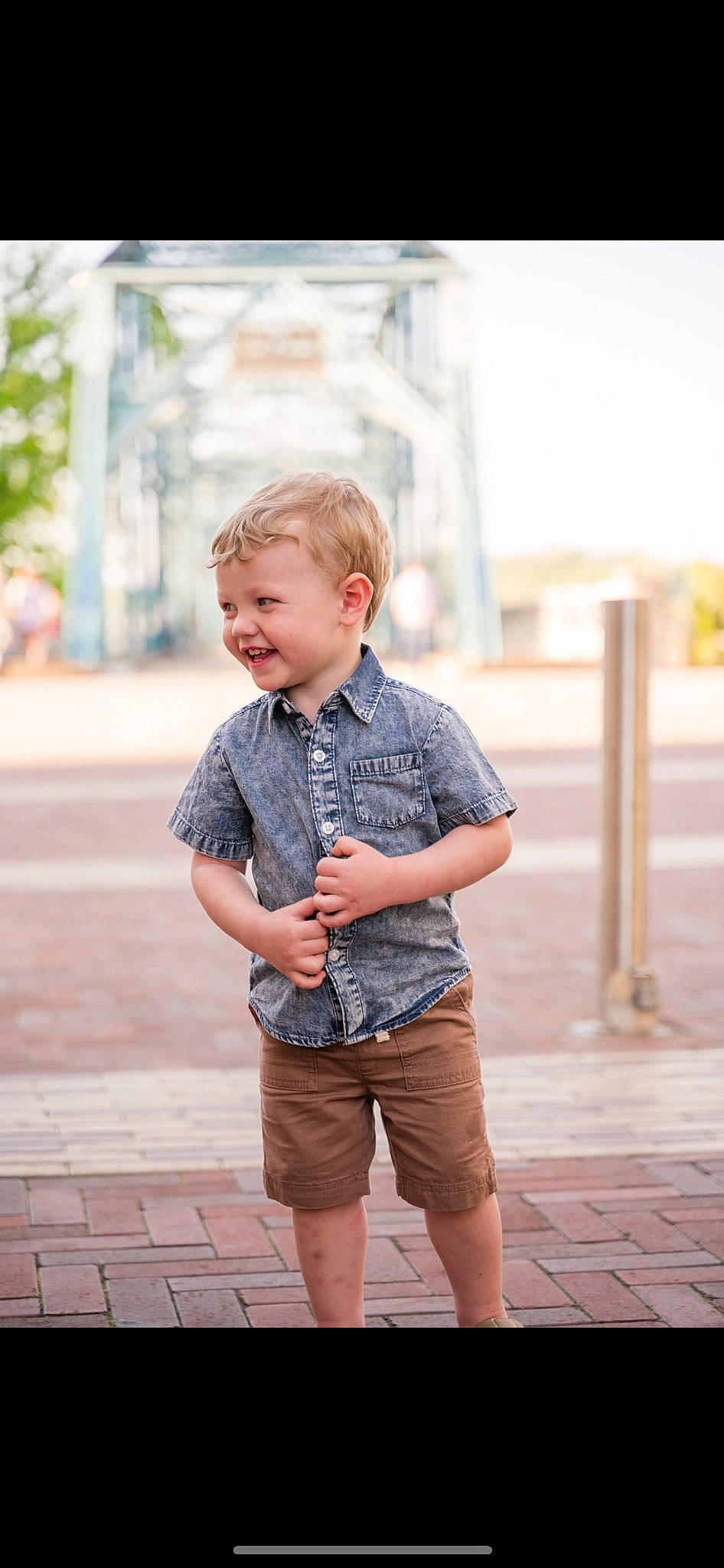 Jackson is registered to the contest to win money with this photo: blond, child, chin, denim, dress_shirt, electric_blue, fun, happy, joy, leisure, pattern, person, plaid, shorts, shoulder, sitting, sleeve, smile, summer, t_shirt