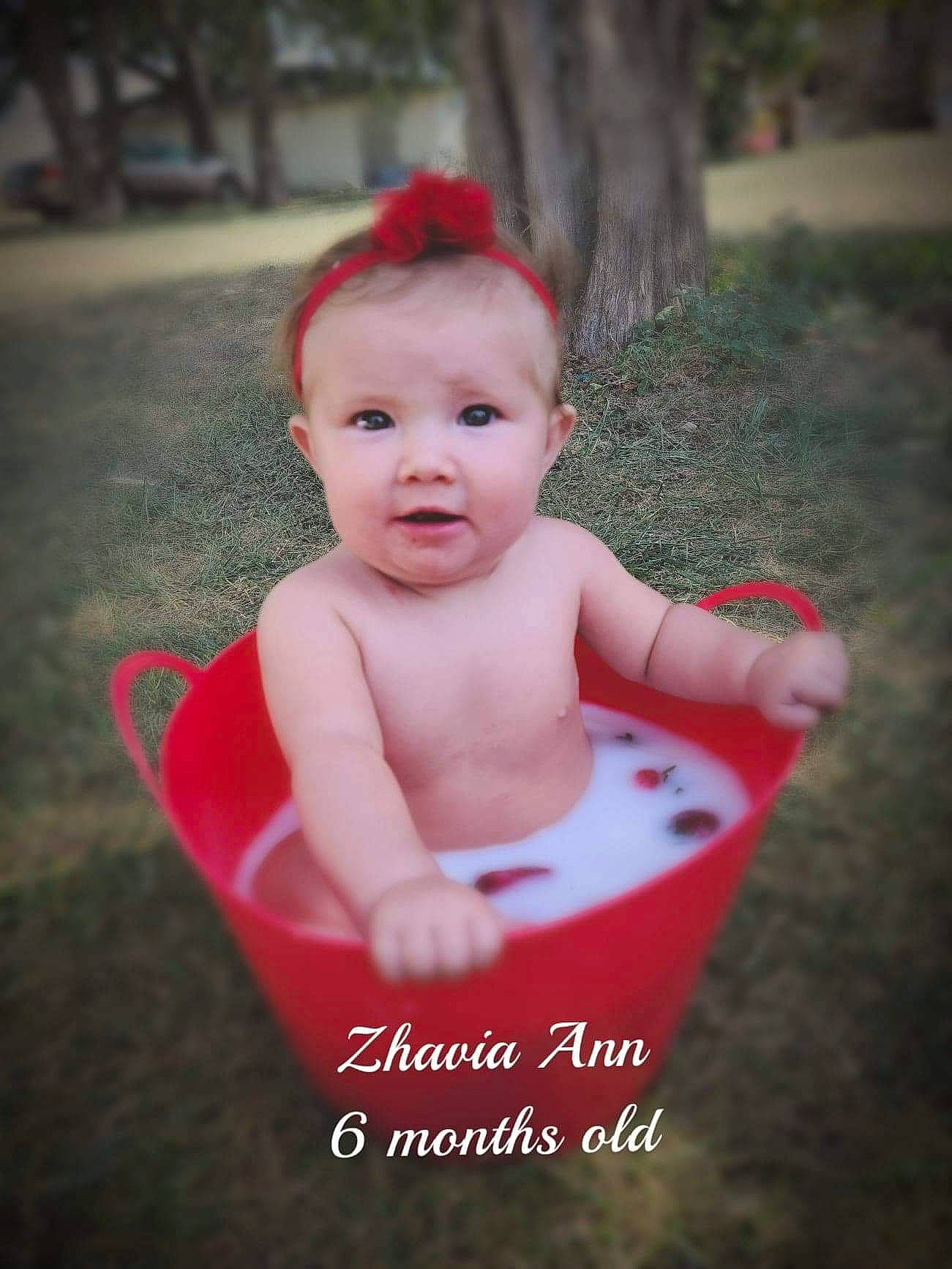 Zhavia joined the competition — help win amazing prizes! baby, baby_products, baby_toddler_clothing, child, face, hair_accessory, head, headgear, lip, person, photo_caption, photograph, photography, pink, plant, product, red, skin, smile, toddler