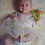 baby, infant, smile, lace_dress, diaper, rattle, toy, blanket, fur_blanket, lying_down, portrait, barefoot, feet, hand, face, head, eyes, soft_texture, tulle, cute