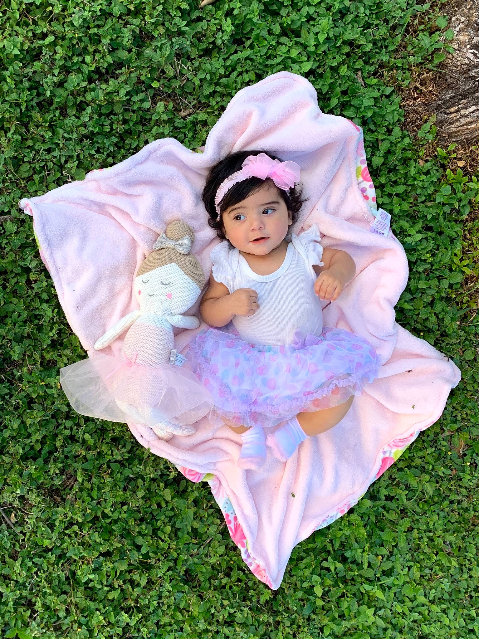 Meadow is registered to the contest to win money with this photo: art, baby, botany, dress, face, flash_photography, grass, grassland, hand, happy, headwear, lawn, magenta, meadow, nature, people_in_nature, person, petal, pink, plant