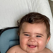 Sofia participe au concours pour gagner de l'argent avec cette photo : baby, cheeks, child, closeup, curly_hair, cushion, cute, expression, face, happy, human, indoors, infant, people, portrait, seated, skin, smiling, tongue, young