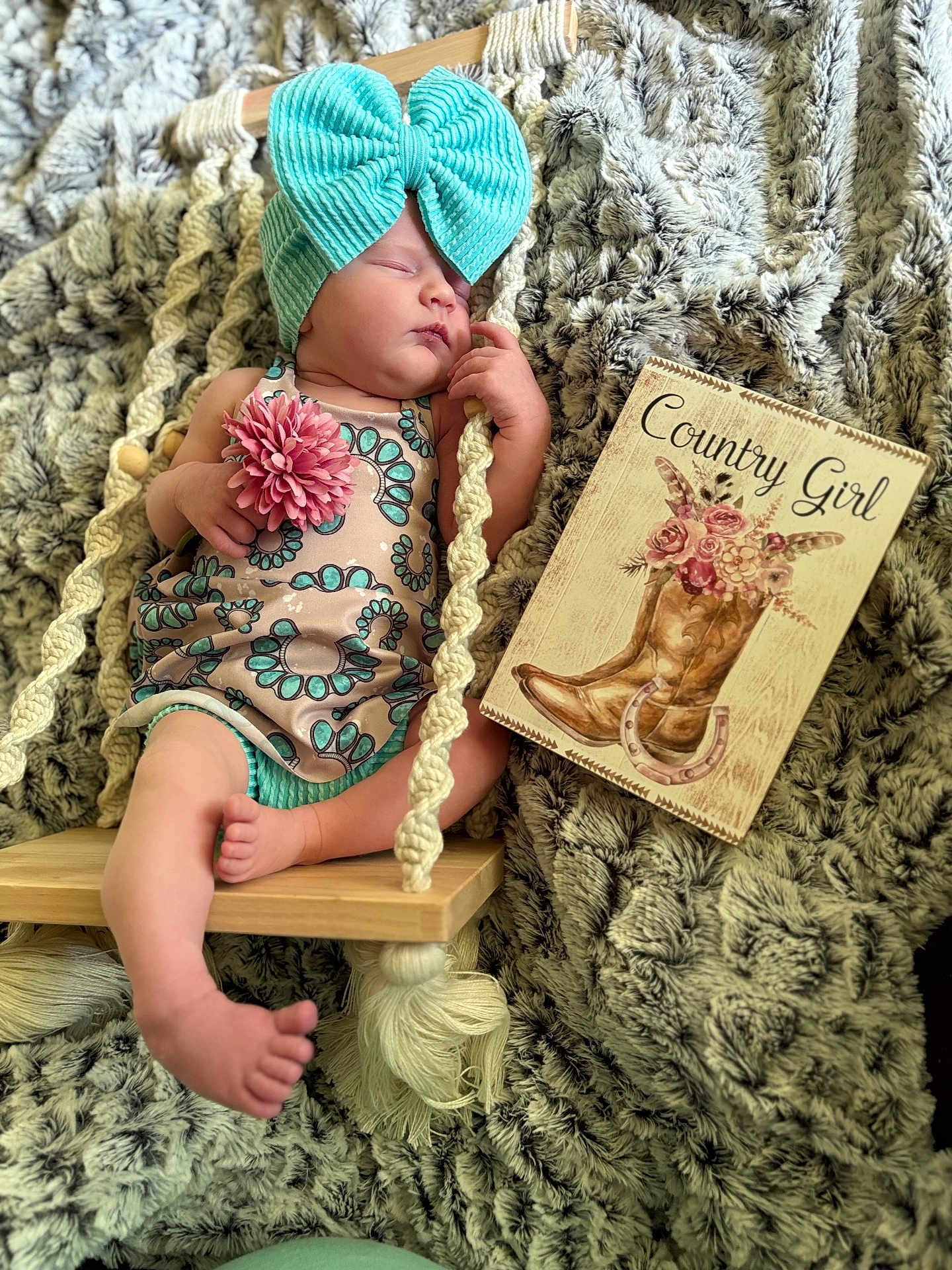 Taylor joined the competition — help win amazing prizes! baby, sleeping, bow, flower, swing, wooden_swing, blanket, cozy, sign, country_girl, cowboy_boot, horseshoe, pink, turquoise, infant, cute, portrait, indoor, resting, child