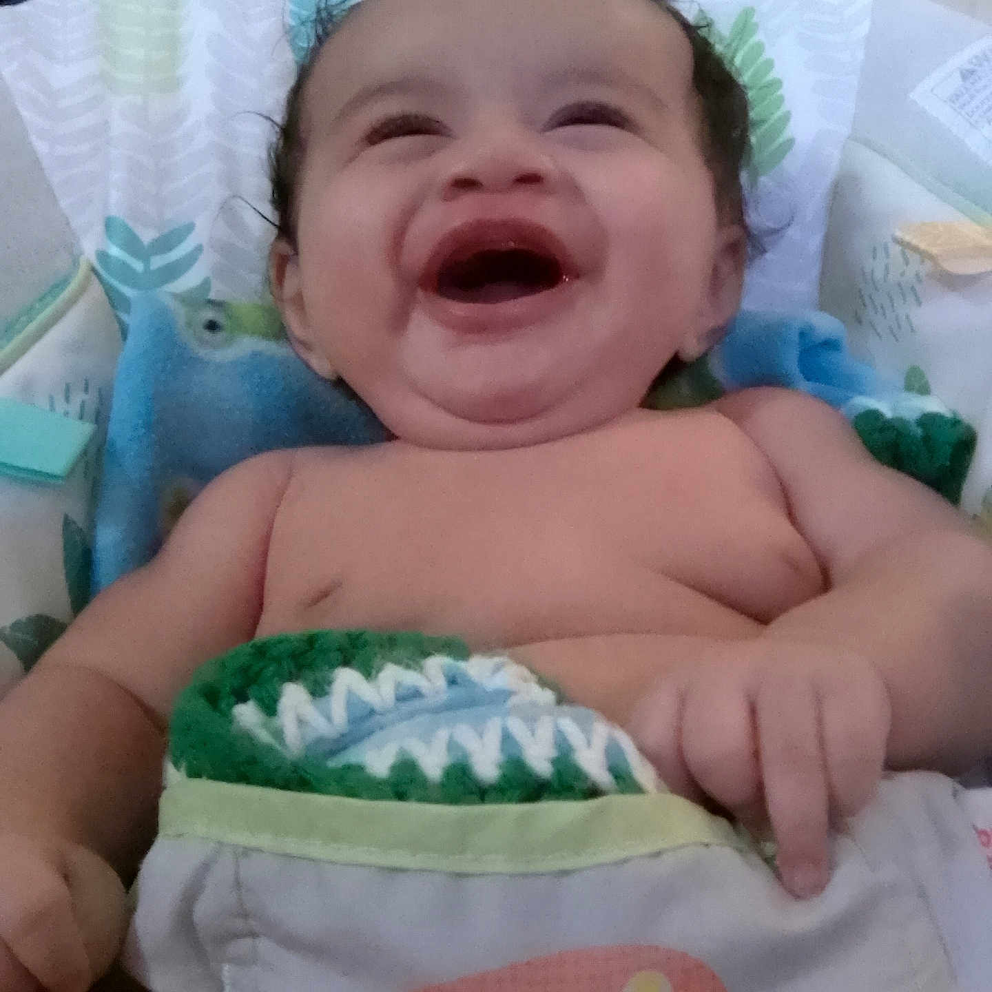 Mokuali'I is registered to the contest to win money with this photo: baby, bed, blanket, bonnet, clothing, cushion, diaper, face, furniture, happy, hat, head, homedecor, laughing, newborn, person, photography, portrait, smile, towel