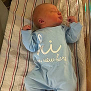 Easton is registered to the contest to win money with this photo: baby, blue_clothing, child, cute, fresh, hospital_bassinet, human, indoor, infant, lying_down, new_life, newborn, onesie, peaceful, portrait, resting, sleeping, small_hands, soft_light, striped_blanket