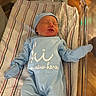 Easton is registered to the contest to win money with this photo: baby, baby_care, blue_onesie, cozy, cute, face, hat, hospital, hospital_bassinet, indoors, infant, mittens, newborn, newborn_clothing, person, portrait, resting, sleep, sleeping, striped_blanket