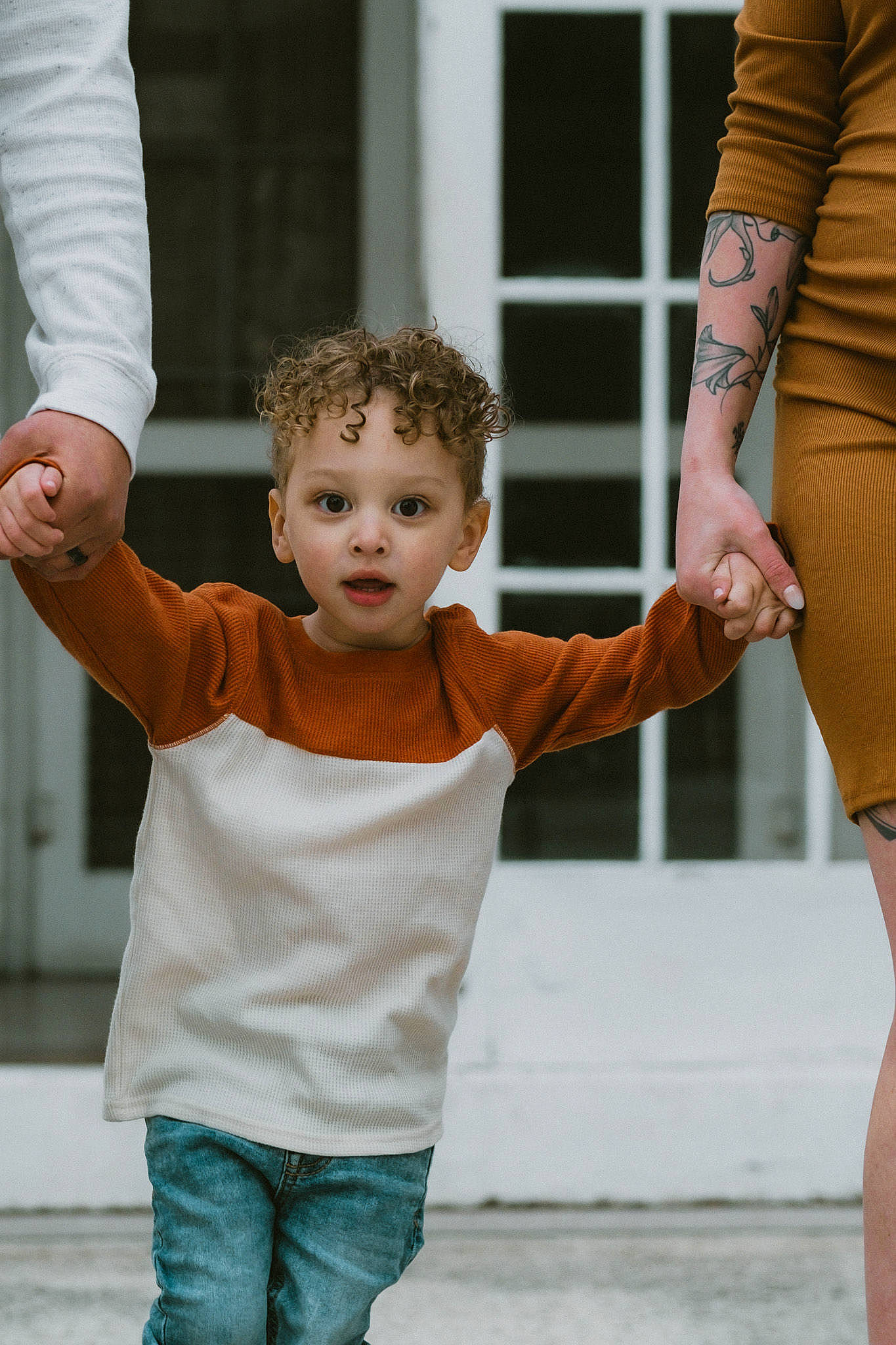 Cainan is registered to the contest to win money with this photo: arm, child, eye, finger, gesture, happy, human, interaction, joint, leg, neck, people, person, photograph, shoulder, sleeve, standing, street_fashion, style, surprise