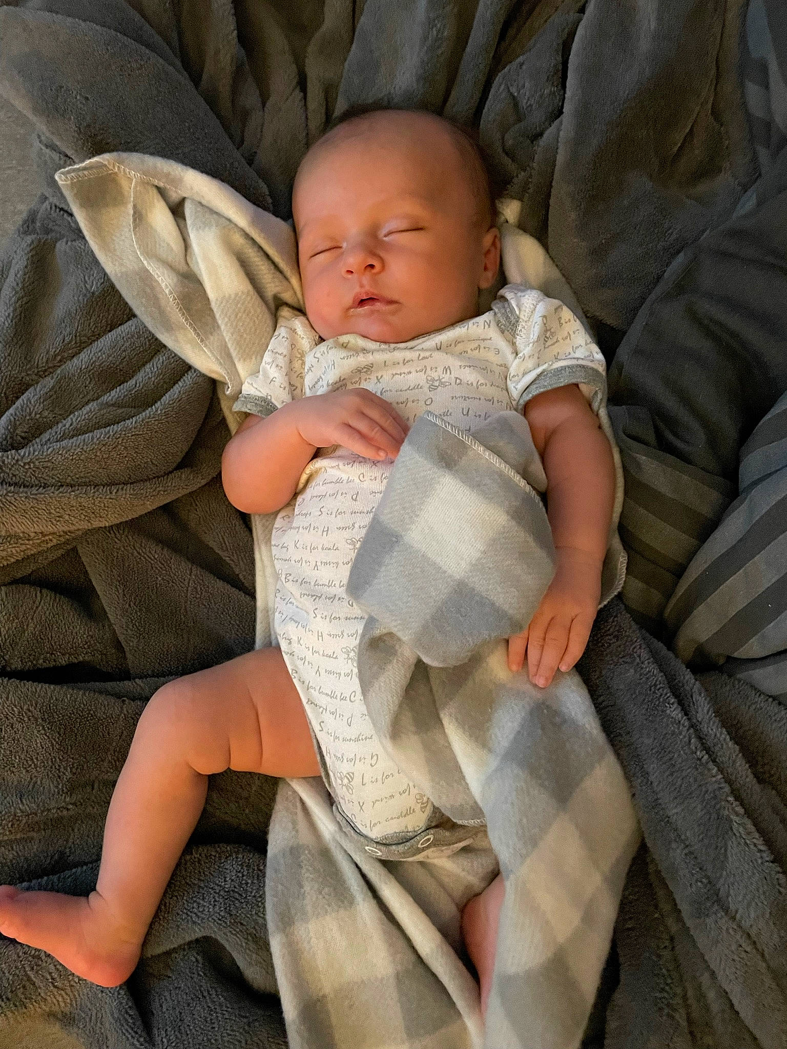 Dominic joined the competition — help win amazing prizes! baby, baby_products, baby_toddler_clothing, child, comfort, finger, foot, human_leg, knee, lap, leg, linens, pattern, person, sitting, skin, sleeve, sock, textile, thigh