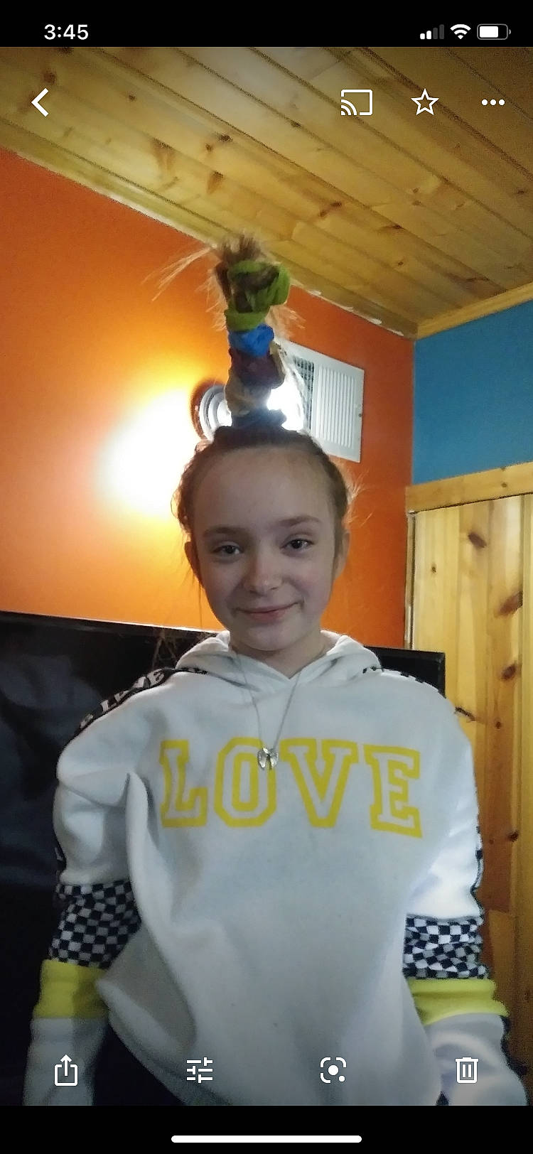 Jessi is registered to the contest to win money with this photo: apron, chair, costume, door, electric_blue, fashion_design, formal_wear, fun, hairstyle, happy, houseplant, jewellery, joy, necklace, person, personal_protective_equipment, room, sleeve, smile, standing