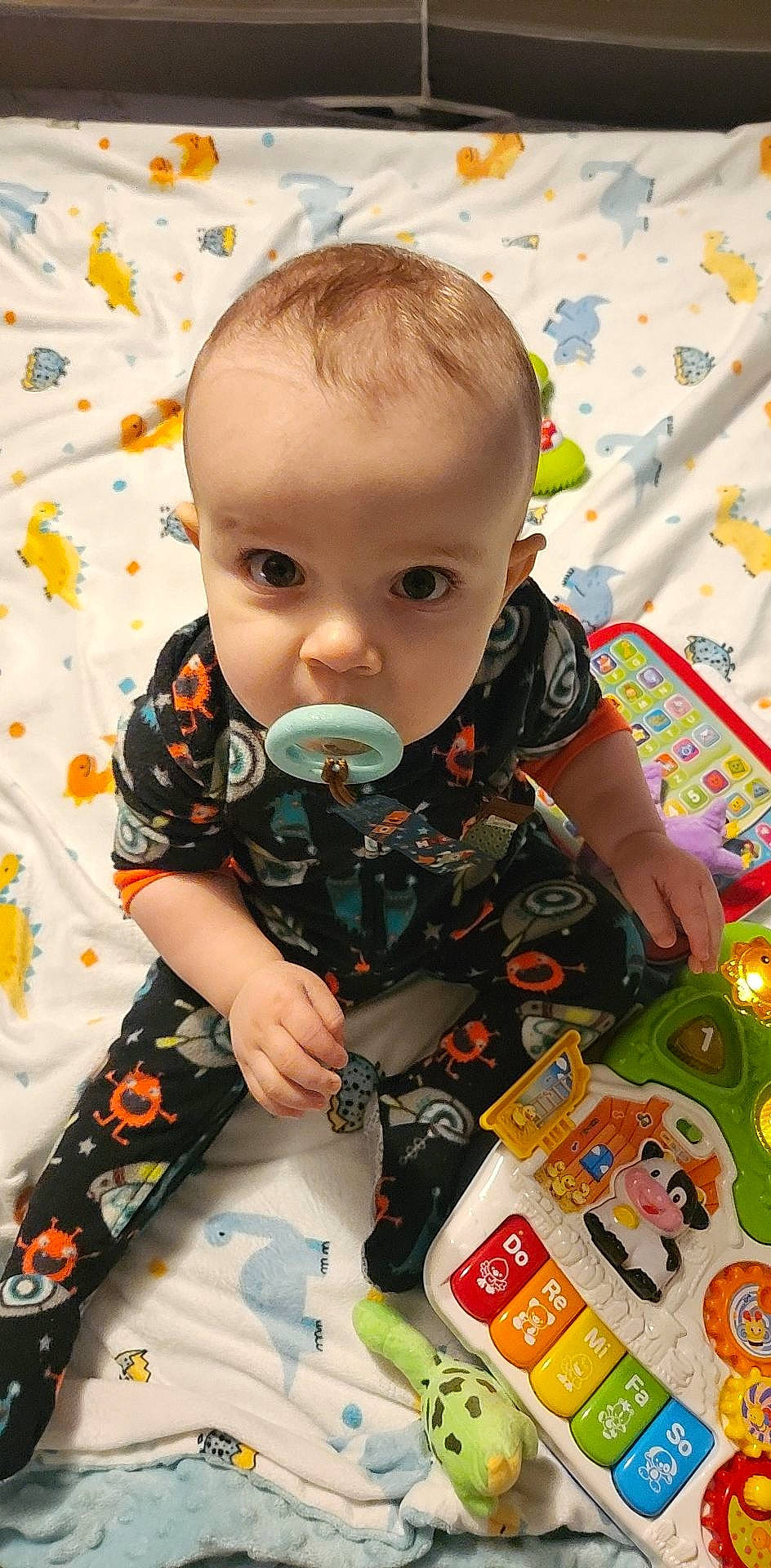 Azrael is registered to the contest to win money with this photo: baby, baby_products, baby_toddler_clothing, baby_toys, cheek, child, fun, happy, head, holiday, iris, pattern, people, person, play, product, room, sitting, sleeve, t_shirt