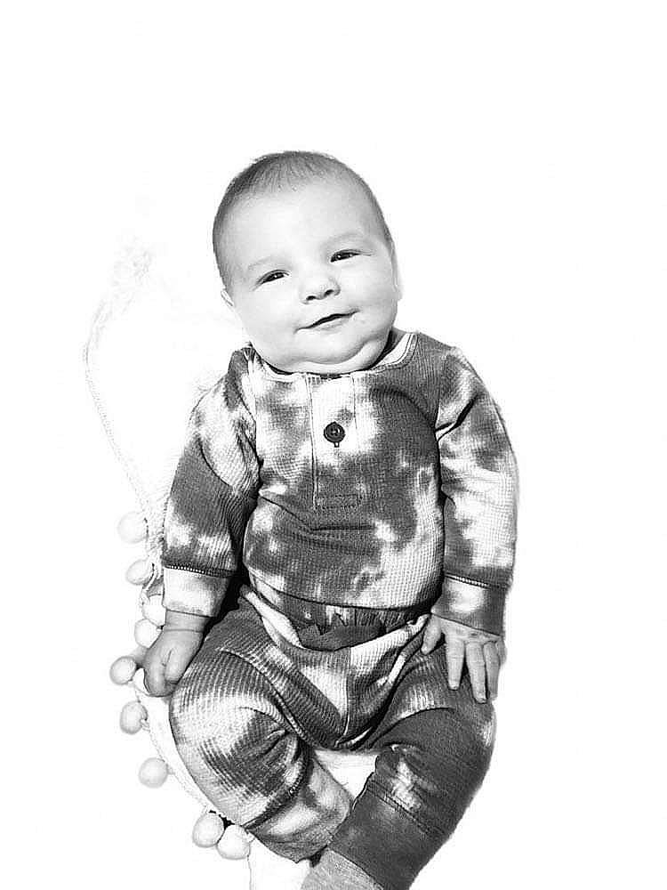 Preston is registered to the contest to win money with this photo: art, baby, baby_toddler_clothing, cheek, child, eye, face, finger, flash_photography, gesture, happy, illustration, monochrome, monochrome_photography, outerwear, pattern, person, sitting, sleeve, smile