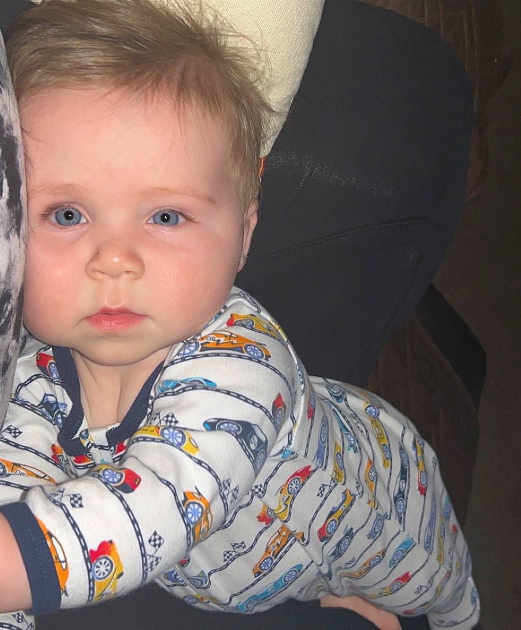 Logan is registered to the contest to win money with this photo: arm, baby_toddler_clothing, cheek, chin, comfort, ear, eye, eyebrow, eyelash, finger, forehead, happy, iris, lip, mouth, neck, nose, person, skin, sleeve