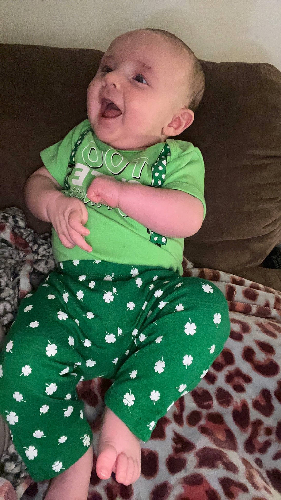 Branson joined the competition — help win amazing prizes! baby, baby_toddler_clothing, child, comfort, eye, face, facial_expression, green, head, iris, lap, linens, neck, pattern, person, product, sitting, sleeve, textile, thigh