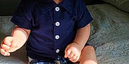 Hunner joined the competition — help win amazing prizes! baby, child, smiling, tongue_out, hat, navy_shirt, plaid_shorts, socks, bed, blanket, indoor, sunlight, happy, cute, infant, portrait, casual_clothing, playful, skin, person