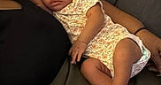 Jateenamarie is registered to the contest to win money with this photo: arm, baby, comfort, couch, cute, dark_background, fingernails, furniture, hand, indoor, infant, newborn, onesie, peaceful, person, relaxation, resting, skin, sleeping, toddler