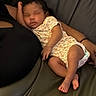 arm, baby, comfort, couch, cute, dark_background, fingernails, furniture, hand, indoor, infant, newborn, onesie, peaceful, person, relaxation, resting, skin, sleeping, toddler