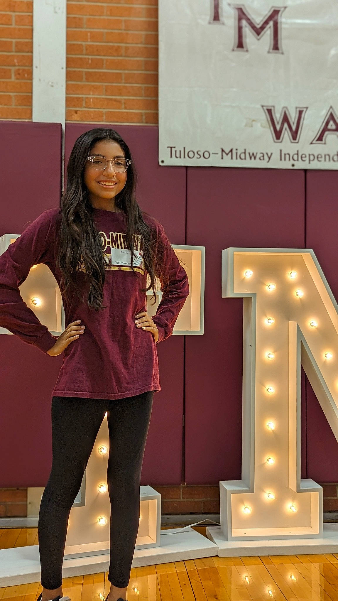 Ariana joined the competition — help win amazing prizes! advertising, electric_blue, event, eyewear, fashion_design, formal_wear, fun, human_leg, joy, knee, leg, leggings, magenta, person, room, sleeve, smile, sportswear, thigh, tights