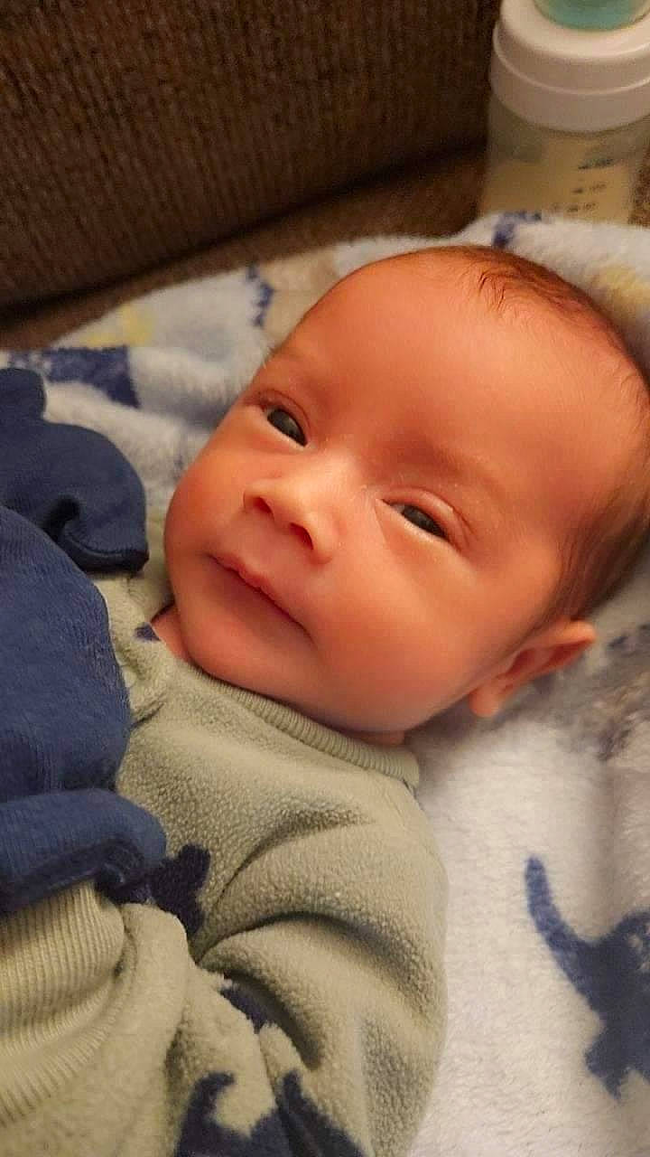 Manuel is registered to the contest to win money with this photo: baby, baby_toddler_clothing, cheek, child, chin, comfort, eyebrow, face, iris, linens, nose, person, skin, smile, toddler