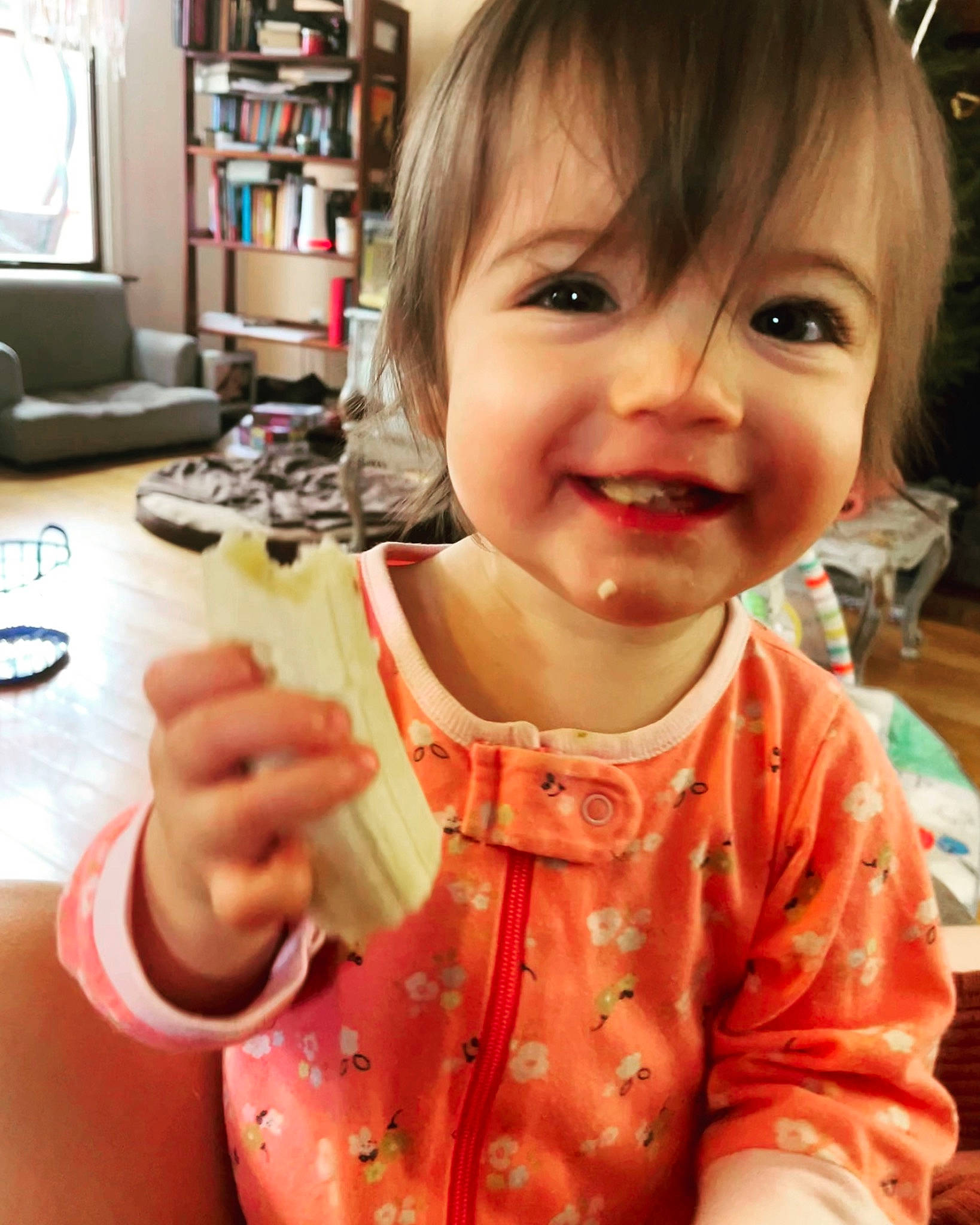 Ariella is registered to the contest to win money with this photo: arm, baby, baby_toddler_clothing, cheek, eye, eyelash, face, finger, hair, hand, happy, head, human_body, joy, lip, mouth, nose, person, skin, sleeve