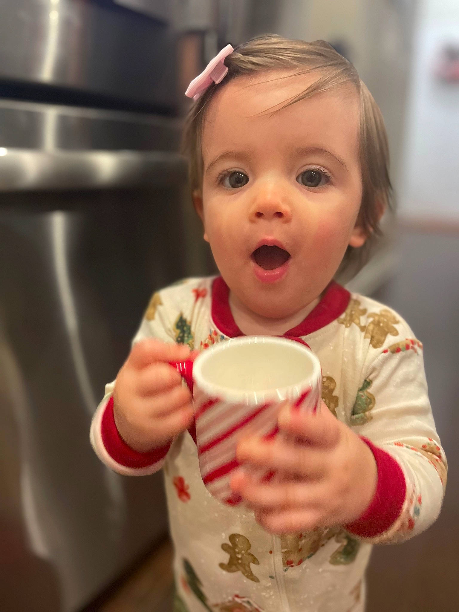 Ariella is registered to the contest to win money with this photo: cheek, child, chin, coffee_cup, cup, drink, drinkware, eyelash, finger, fun, hand, happy, nose, person, serveware, sink, sleeve, surprise, sweetness, tableware