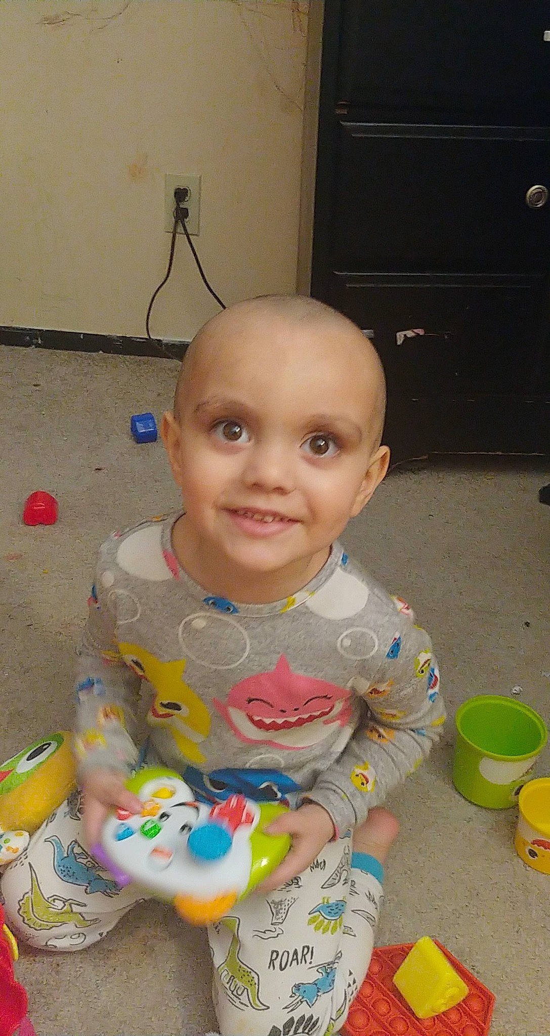 Abraham is registered to the contest to win money with this photo: baby, baby_products, baby_toddler_clothing, baby_toys, cheek, child, chin, eye, face, flooring, fun, happy, head, joy, mouth, person, play, sitting, skin, smile