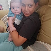 Lounes a rejoint le concours — aidez-le/la à gagner de superbes lots ! affection, baby, beige, candid, casual_clothing, child, comfort, couch, family, holding, home, indoor, living_room, person, pillow, portrait, sitting, toddler, together, wide_eyes