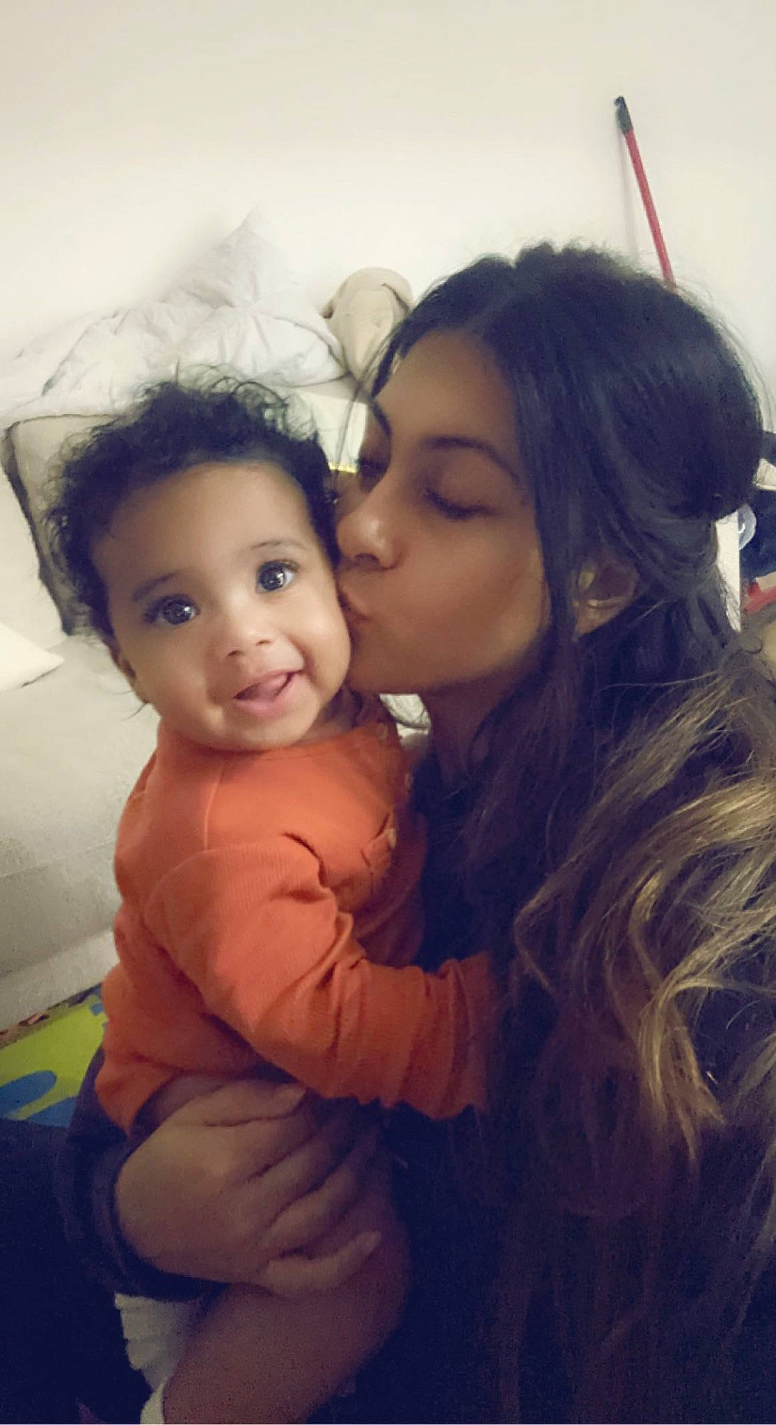 Amari is registered to the contest to win money with this photo: black_hair, cheek, child, cool, facial_expression, flash_photography, fun, gesture, happy, human, interaction, iris, kiss, lip, mouth, nose, people_in_nature, person, plant, skin