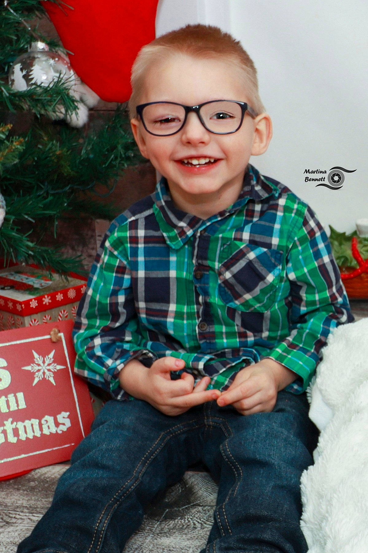 Stanley joined the competition — help win amazing prizes! child, christmas, christmas_eve, christmas_tree, design, glasses, holiday, joy, pattern, person, plaid, sitting, smile, tartan, textile