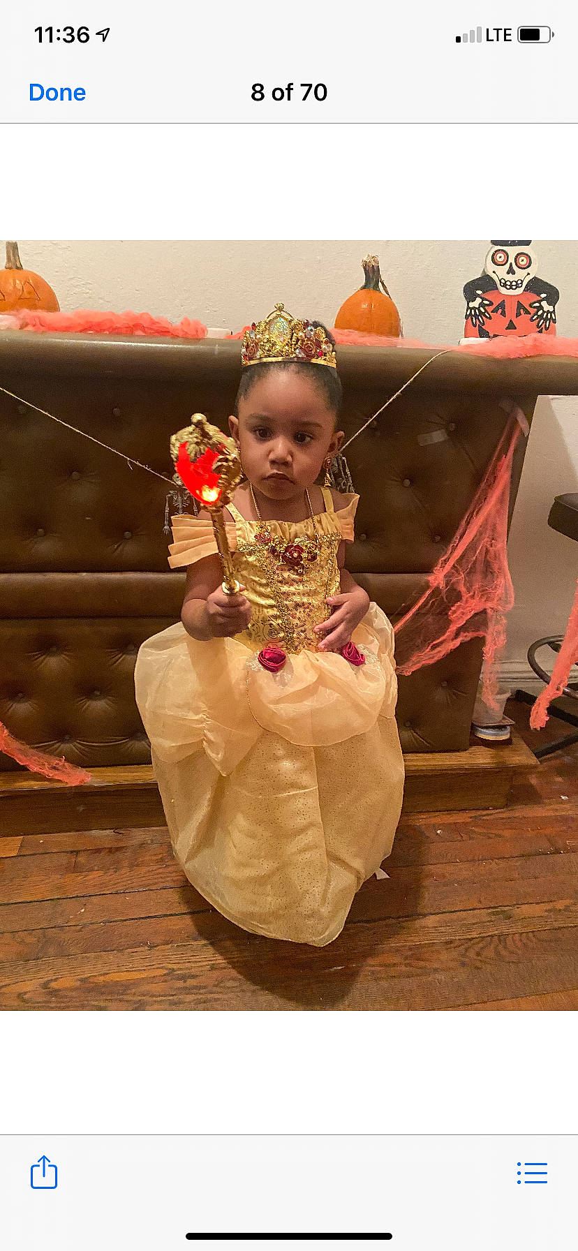 Charli is registered to the contest to win money with this photo: costume, costume_design, crown, embellishment, fashion_accessory, hair_accessory, headgear, headpiece, makeover, peach, person, shelf, shelving, tiara, toy, tradition