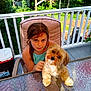 backyard, brown_hair, chair, child, cooler, cute, dog, face, girl, glass_table, greenery, long_hair, outdoor, pet, porch, puppy, railing, sitting, summer, trees