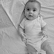 Reign joined the competition — help win amazing prizes! baby, bed, black_and_white, child, cute, face, hands, indoors, infant, legs, looking_up, lying_down, monochrome, onesie, person, portrait, sheet, soft_light, wrinkles, young