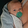 Koah joined the competition — help win amazing prizes! baby, infant, child, pacifier, blanket, swaddled, portrait, face, blue_eyes, wide_eyed, cozy, indoors, closeup, parent, holding, clothing, textile, stars, cuddling, photograph