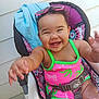 Honesty is registered to the contest to win money with this photo: baby, child, smiling, happy, sunglasses, pink, green, swimsuit, seat, baby_seat, colorful, cute, outdoor, arm, person, infant, joyful, playful, summer, fun