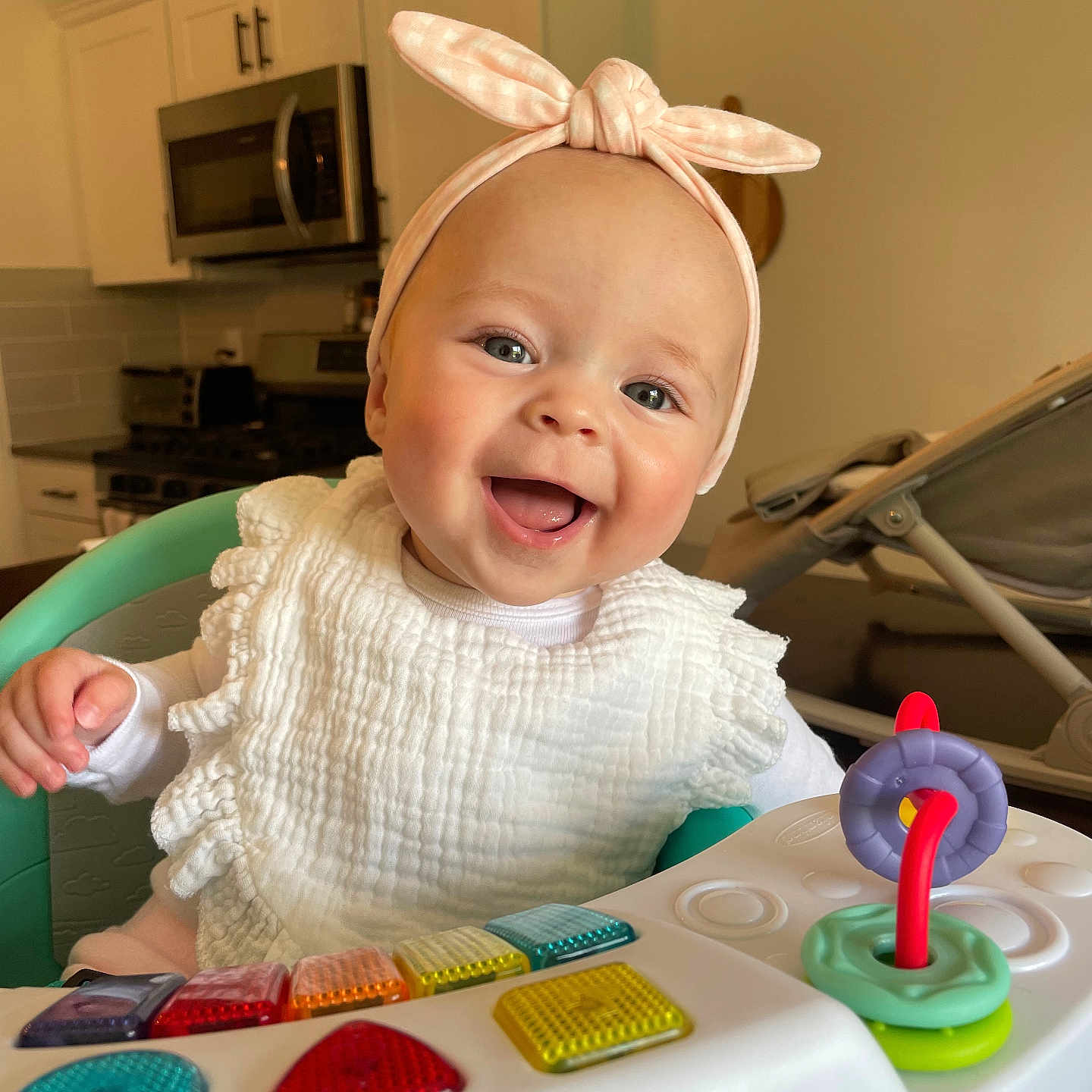 Alivia joined the competition — help win amazing prizes! appliance, baby, babylaughing, bodypart, device, electricaldevice, electronics, face, finger, hand, happy, head, indoors, microwave, mobilephone, oven, person, phone, photography, portrait