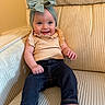 baby, child, smiling, headband, bow, jeans, top, sitting, couch, furniture, indoors, happy, cute, portrait, person, infant, clothing, comfort, relaxed, bright