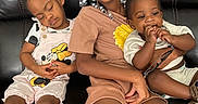 Dale is registered to the contest to win money with this photo: child, children, sitting, couch, leather, smiling, sleeping, glasses, braids, beads, clothing, footwear, indoor, family, cute, playful, happy, relaxed, portrait, toddler