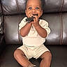 Dale joined the competition — help win amazing prizes! toddler, child, smiling, sitting, leather_couch, sunglasses, clothing, shoes, happy, portrait, indoor, cute, baby, playful, person, small_child, casual, comfort, seated, expression