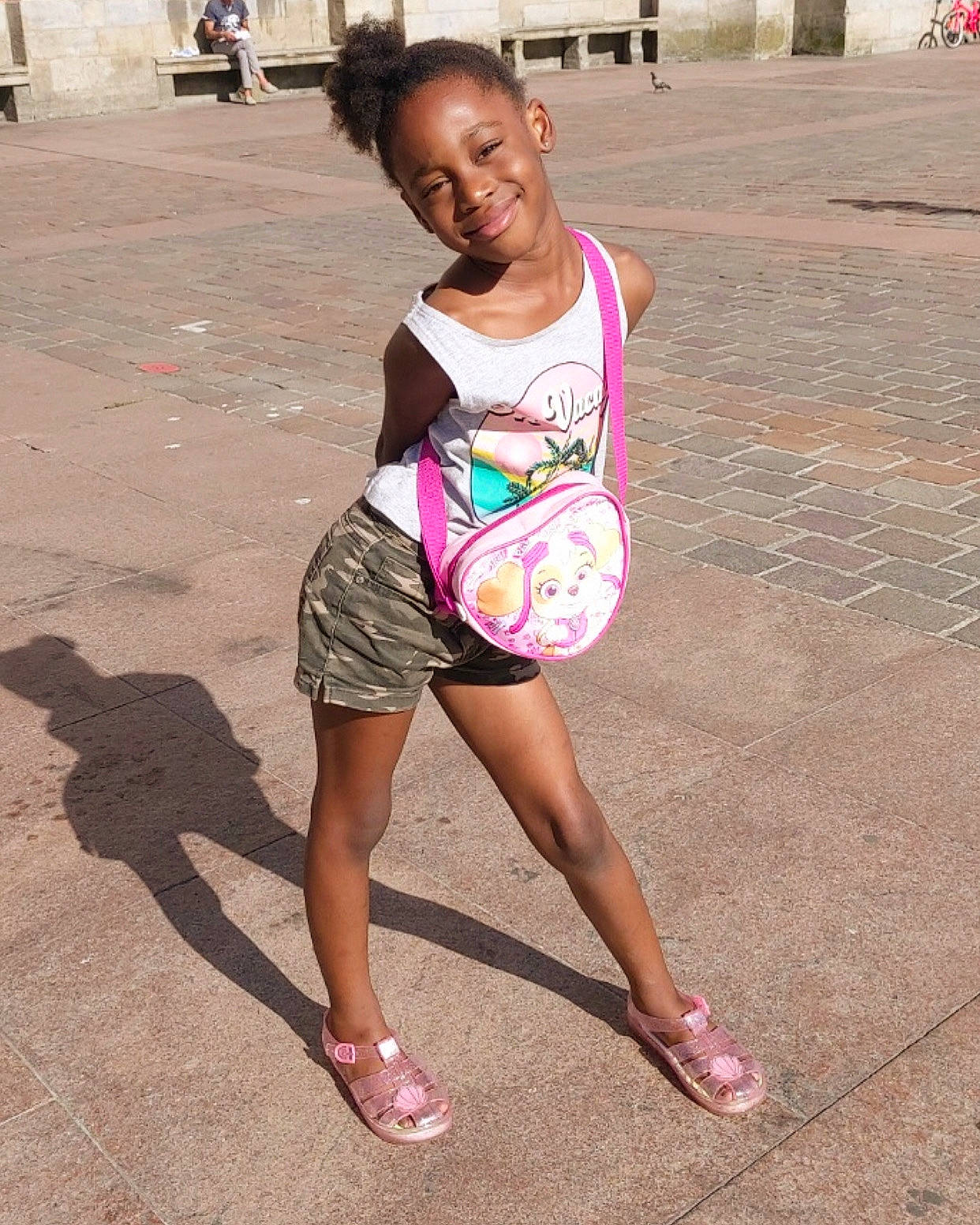 Mya participe au concours pour gagner de l'argent avec cette photo : asphalt, barefoot, beauty, child, eyewear, foot, fun, happy, human_leg, joy, leisure, magenta, person, pink, recreation, road, sandal, shorts, smile, thigh